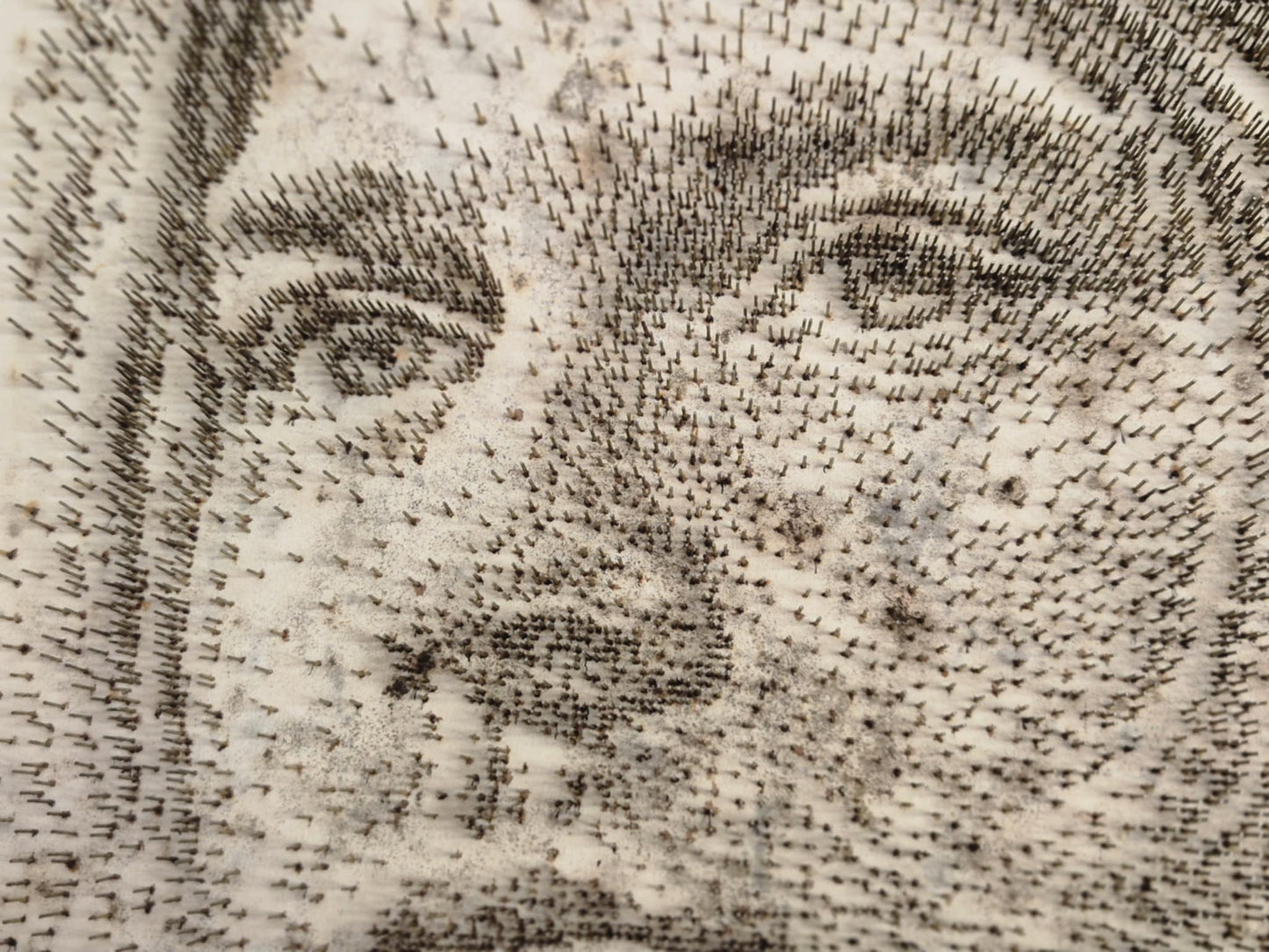 Close-up of steel pin artwork forming Kurt Cobain by George Wolberg
