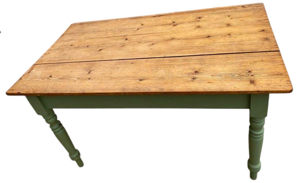 Top view of rustic pine plank dining table with natural oiled finish.