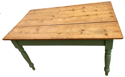 Top view of rustic pine plank dining table with natural oiled finish.