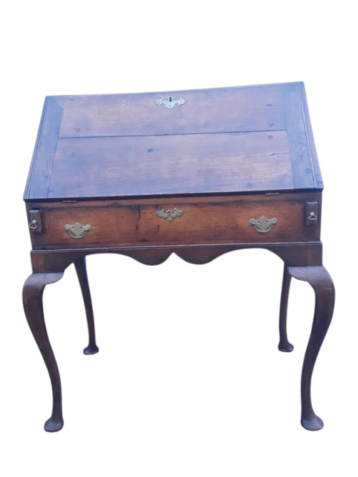 Antique Georgian oak fall-front bureau on cabriole legs with fitted interior, small drawers, and pad feet, circa 18th century.