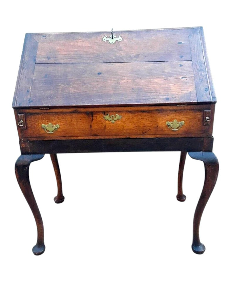 Antique Georgian oak fall-front bureau on cabriole legs with fitted interior, small drawers, and pad feet, circa 18th century.