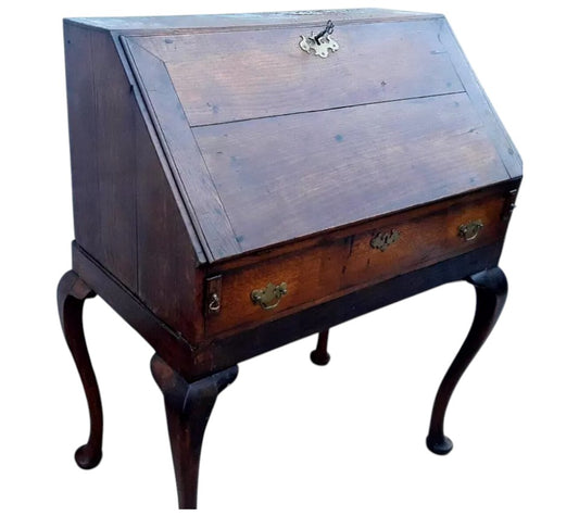 Antique Georgian oak fall-front bureau on cabriole legs with fitted interior, small drawers, and pad feet, circa 18th century.