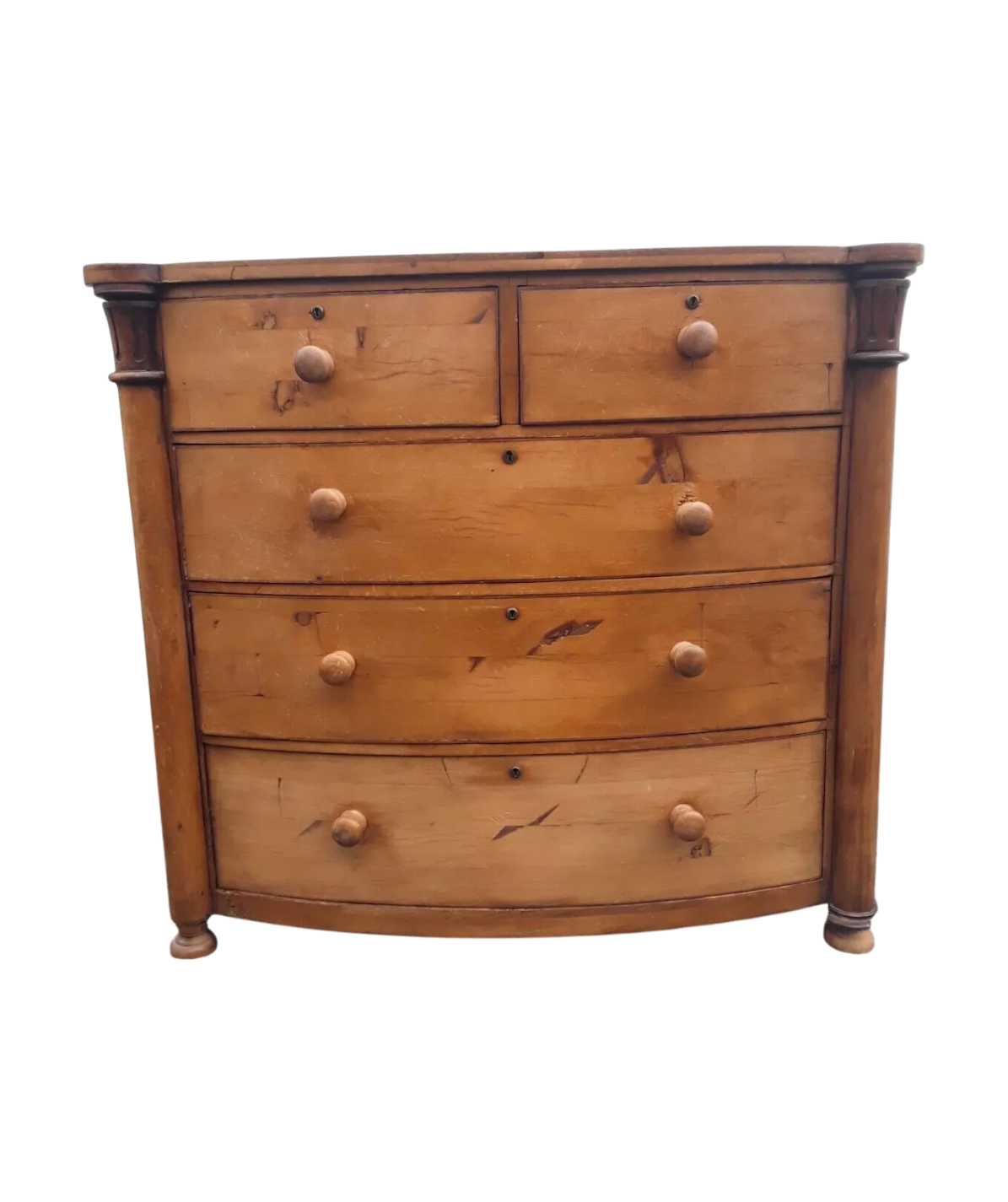 Victorian solid pine bow-front chest of drawers with elegant rustic patina and ample storage.