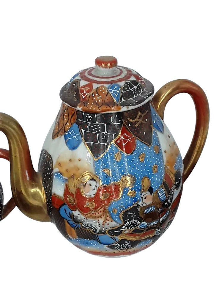 Antique Japanese hand-painted porcelain coffee set with coffee pot, sugar pot, cups, and saucers, richly decorated with figures and gilded detail.
