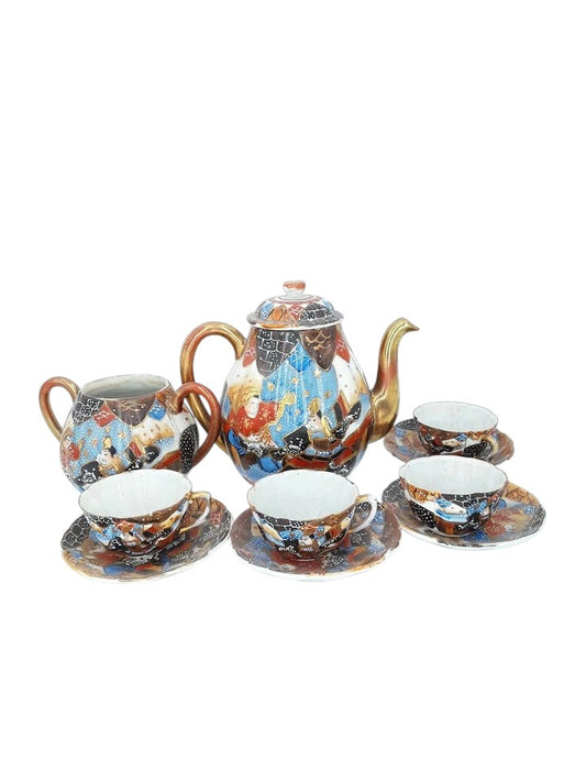 Antique Japanese hand-painted porcelain coffee set with coffee pot, sugar pot, cups, and saucers, richly decorated with figures and gilded detail.