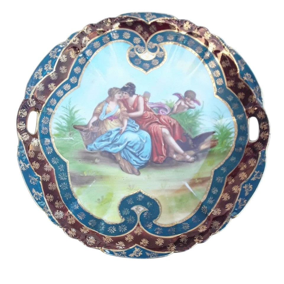 Close-up of central hand-painted romantic scene on Vienna porcelain plate