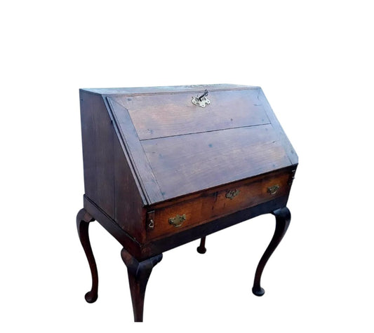 Antique Georgian oak fall-front bureau on cabriole legs with fitted interior, small drawers, and pad feet, circa 18th century.