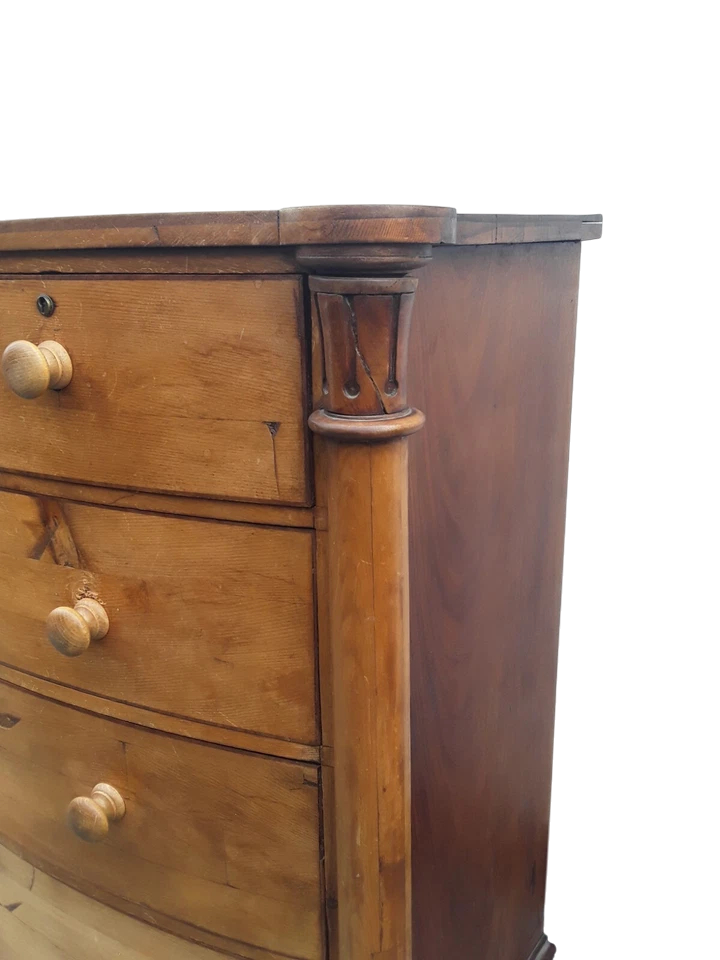 Victorian solid pine bow-front chest of drawers with elegant rustic patina and ample storage.