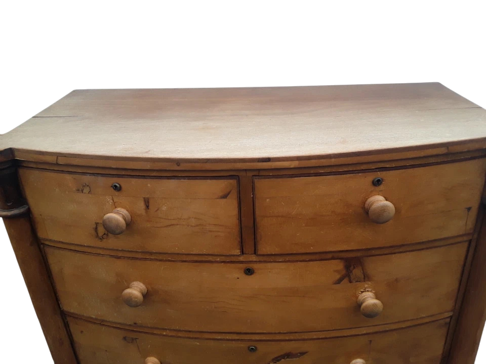 Victorian solid pine bow-front chest of drawers with elegant rustic patina and ample storage.