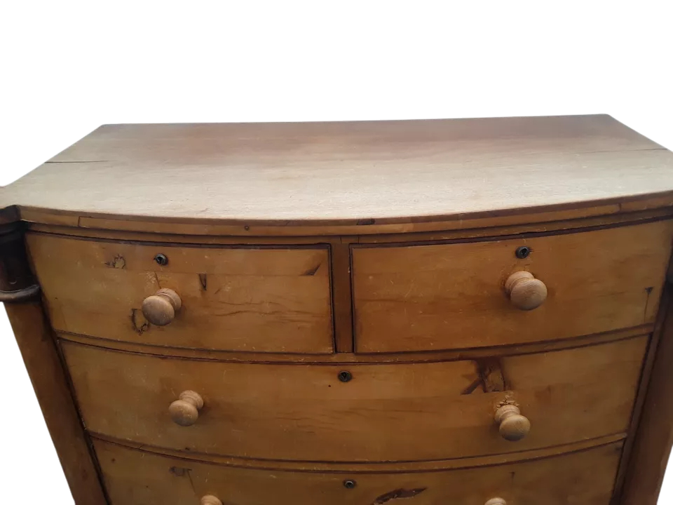 Wooden dresser with four drawers on a white background