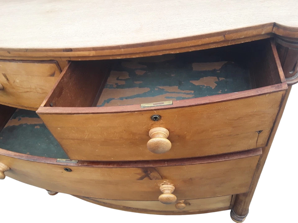 Victorian solid pine bow-front chest of drawers with elegant rustic patina and ample storage.