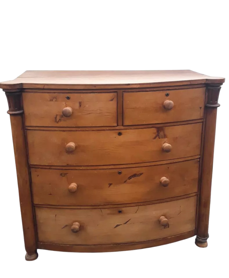 Victorian solid pine bow-front chest of drawers with elegant rustic patina and ample storage.